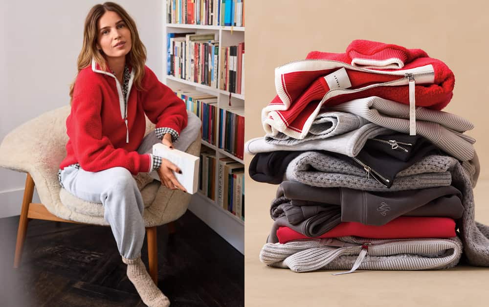Woman wearing red Varley sweatshirt with grey sweatpants