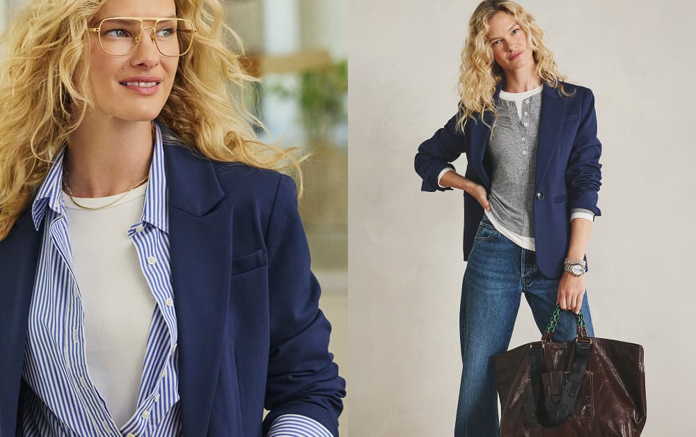 Image of woman wearing navy blazer over a striped button down and jeans