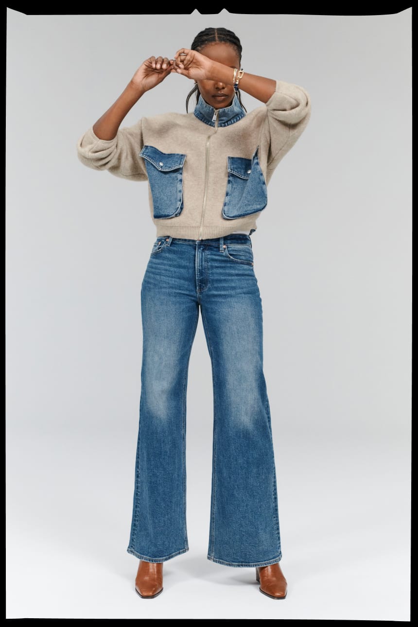 Image of woman wearing blue wide leg jeans