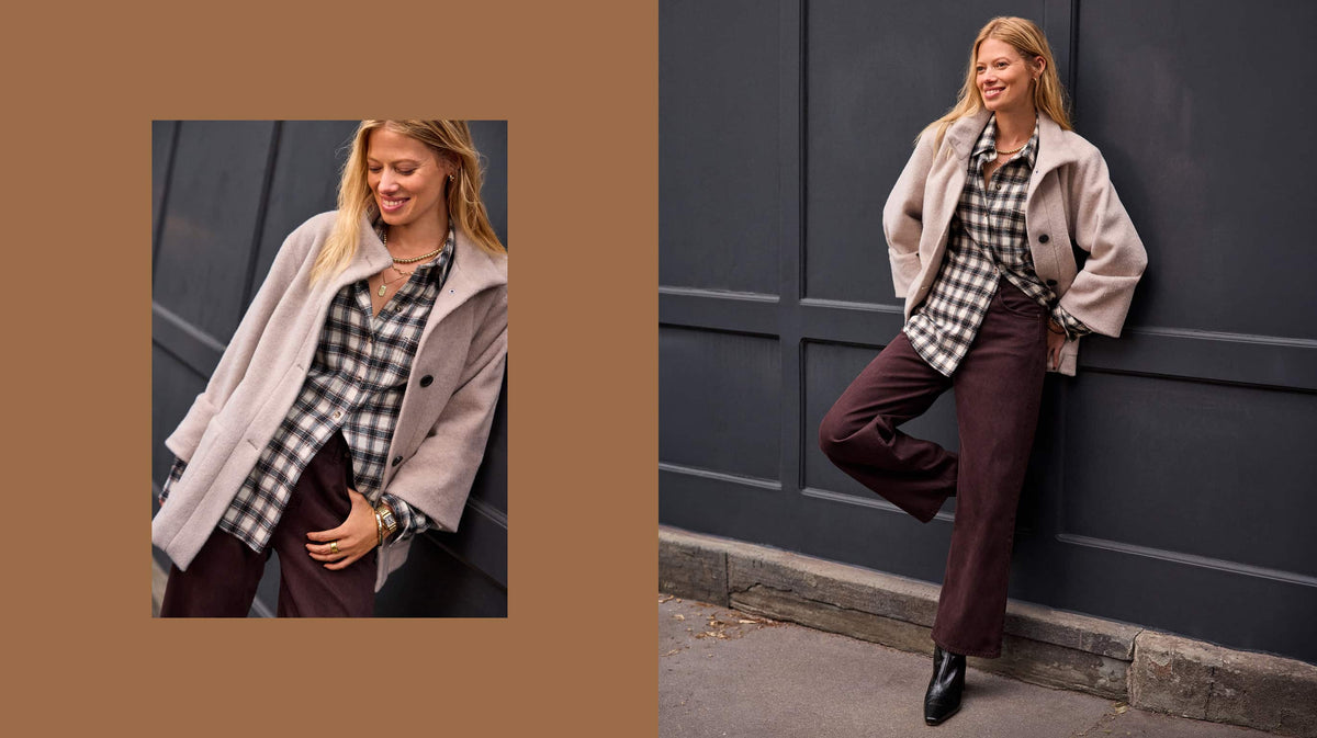 Woman wearing dark brown jeans with a laid shirt and ivory wool overcoat.