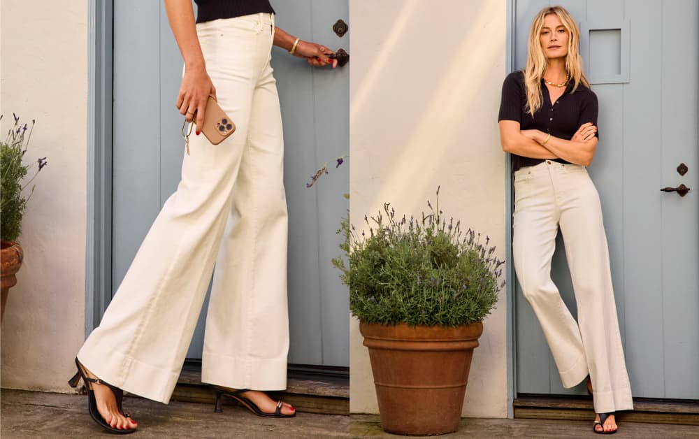 Image of woman wearing ivory wide leg jeans with a black tee and black sandals