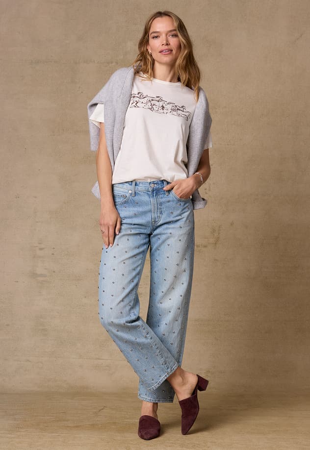 Image of woman wearing novelty jeans with silver studs