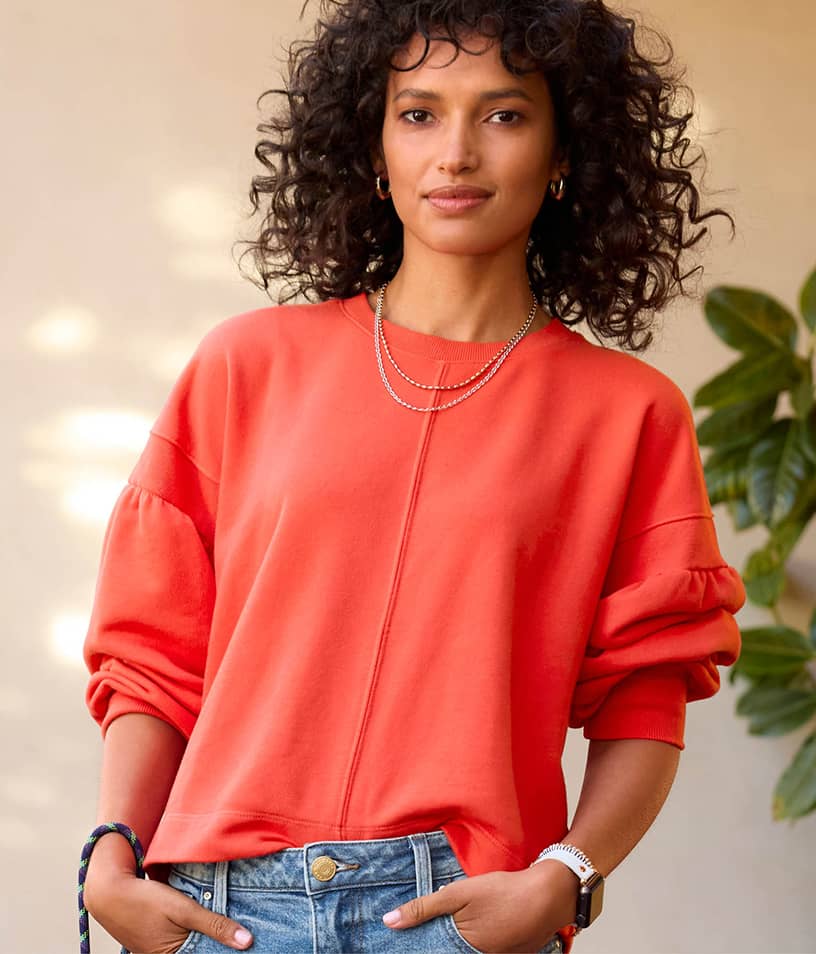 Image of woman wearing a red sweatshirt