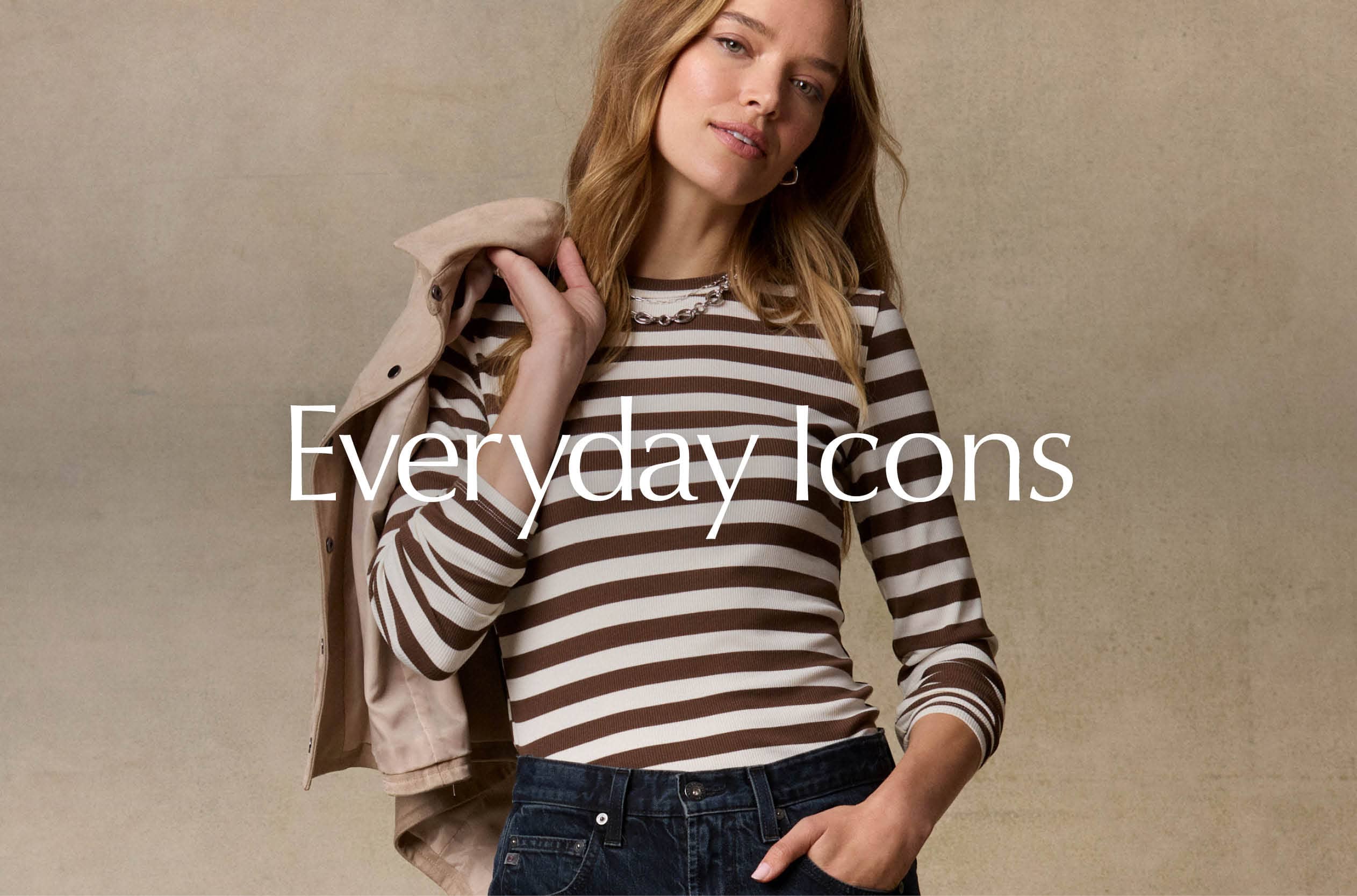 Image of woman wearing black pants, blue tee, and sneakers