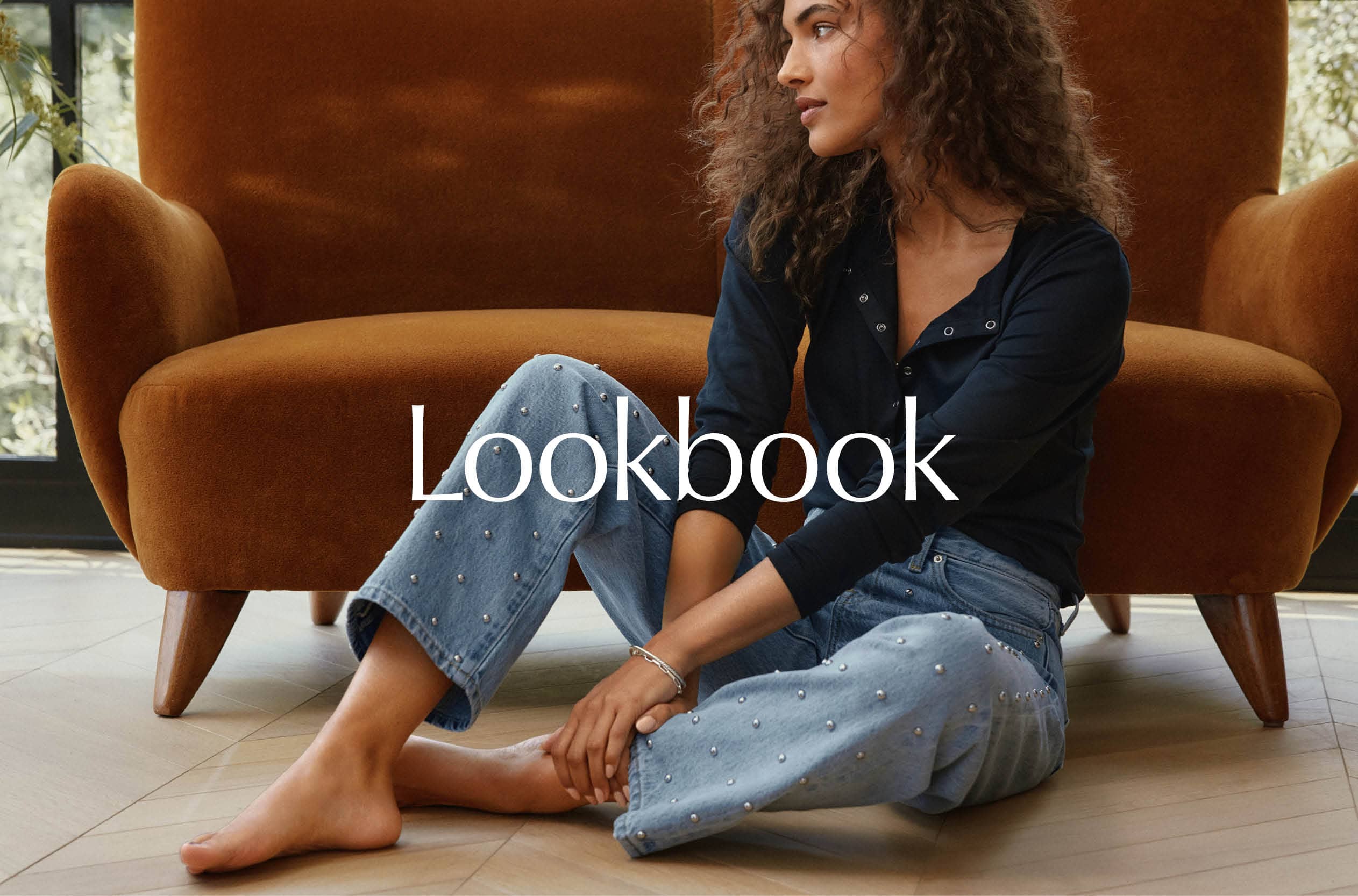 Image of woman wearing a top with blue jeans, Lookbook