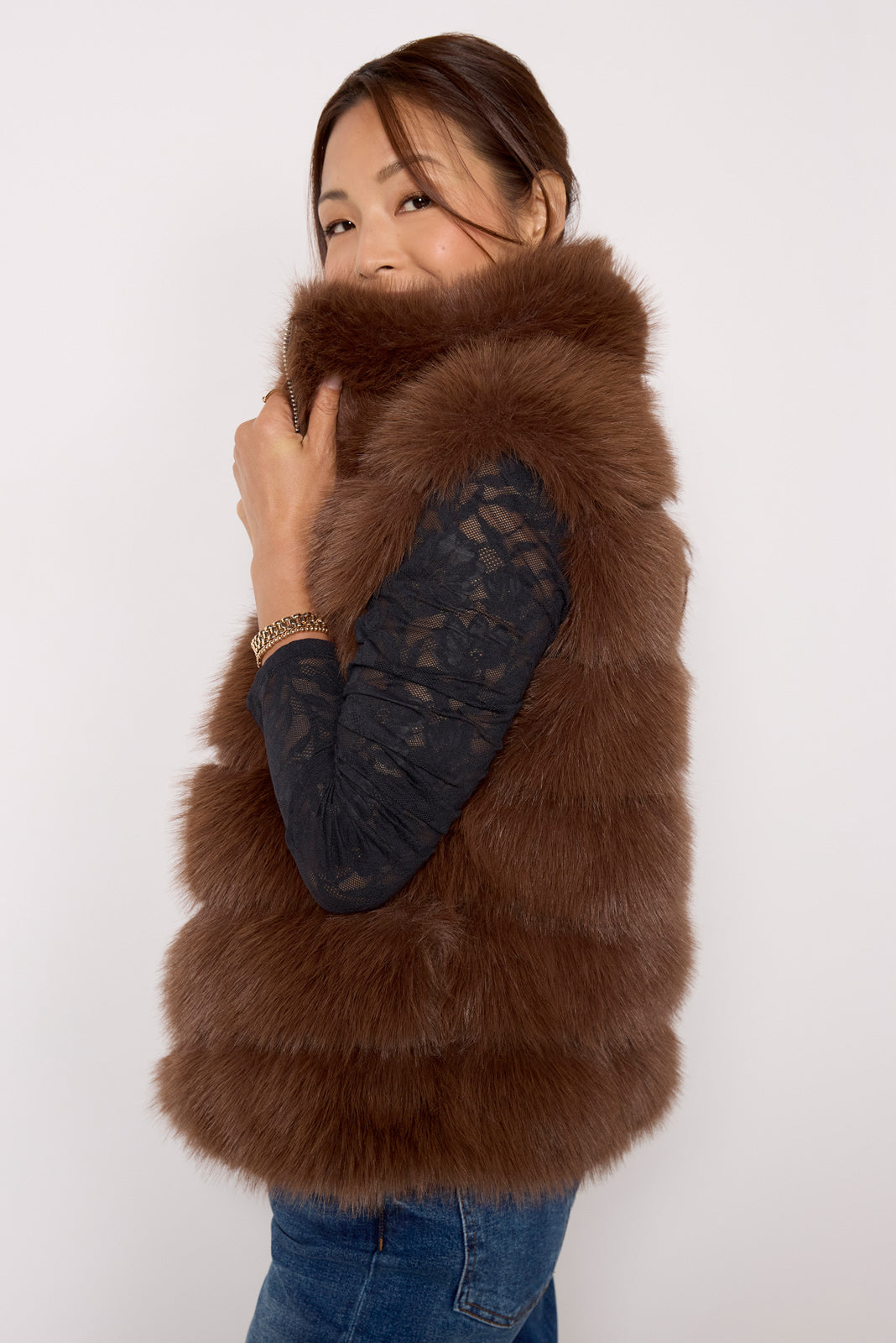 Offers faux fur vest