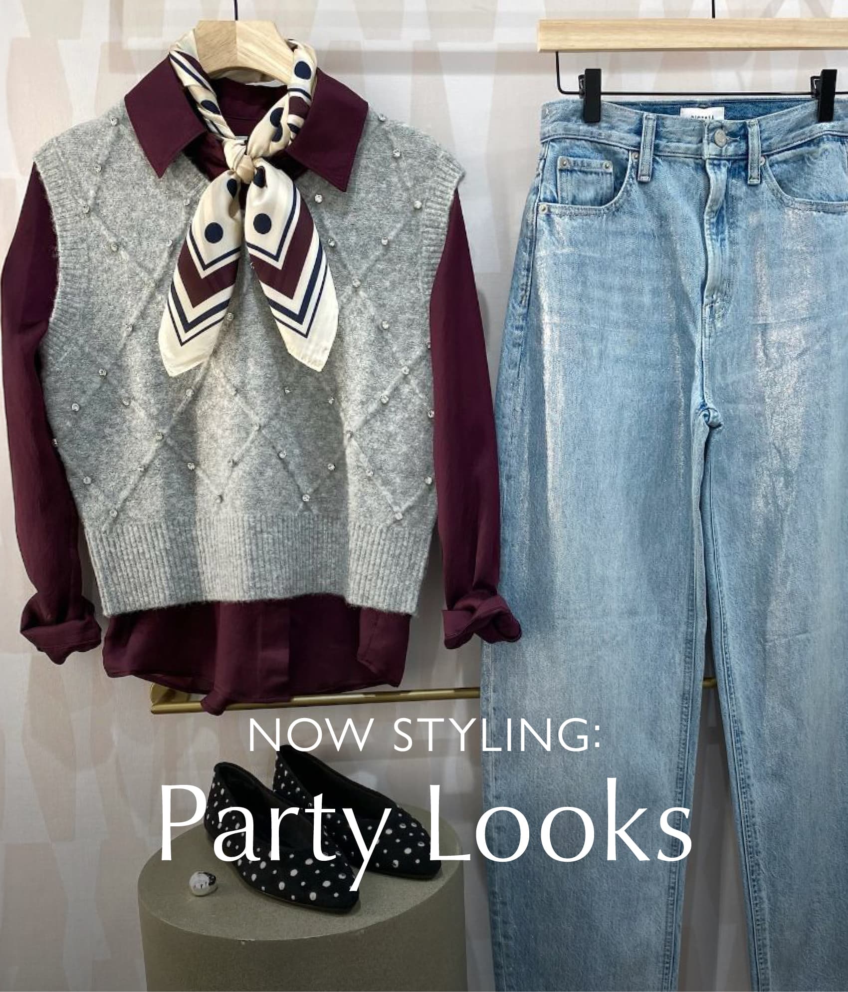 Image of rhinestone-studded sweater vest with scarf, blouse, and coated jeans.