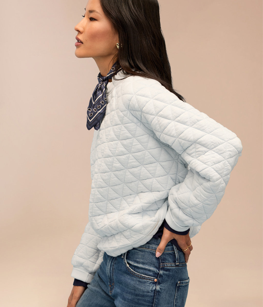 Image of woman wearing blue sweatshirt