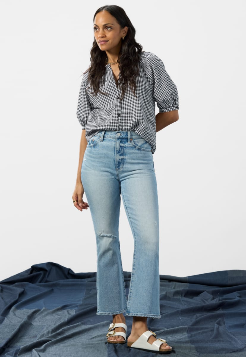 Image of woman wearing bootcut jeans with a flare leg