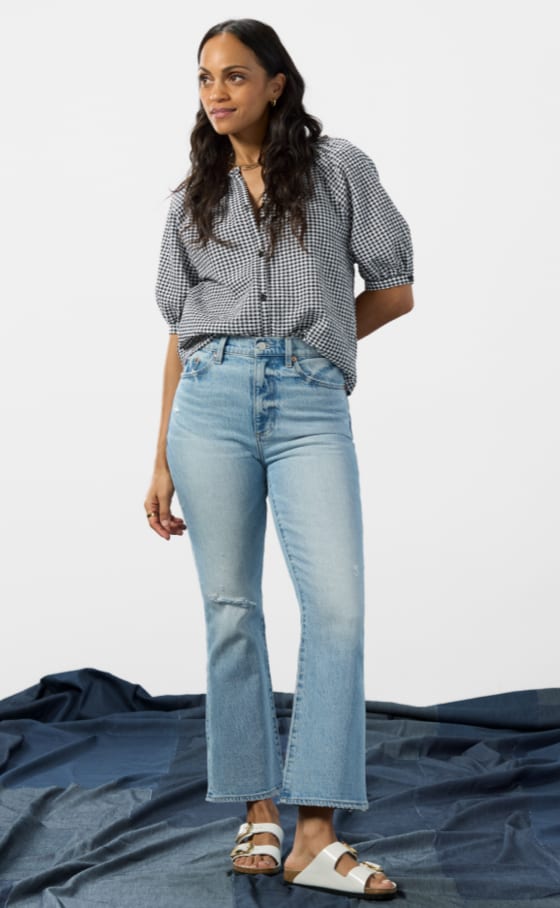 Image of woman wearing bootcut jeans with a flare leg