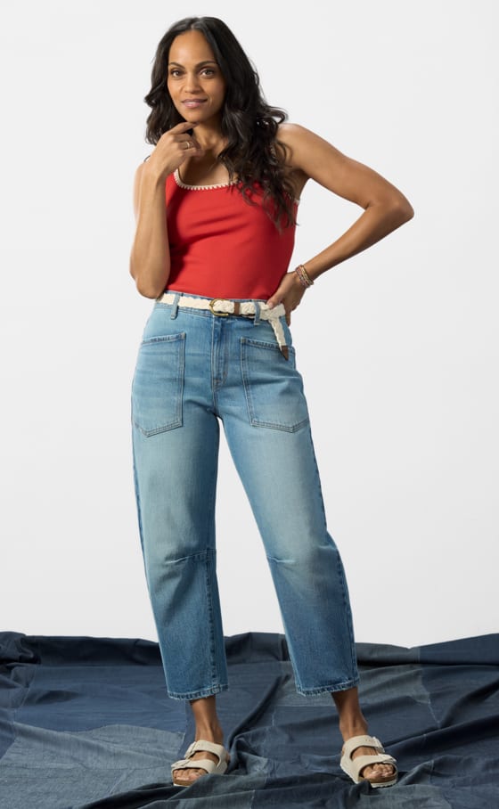 Image of woman wearing boyfriend style jeans with a barrel leg