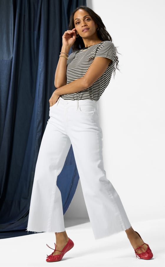 Image of woman wearing white wide leg jeans