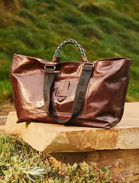 Image of a brown leather Clare V tote bag