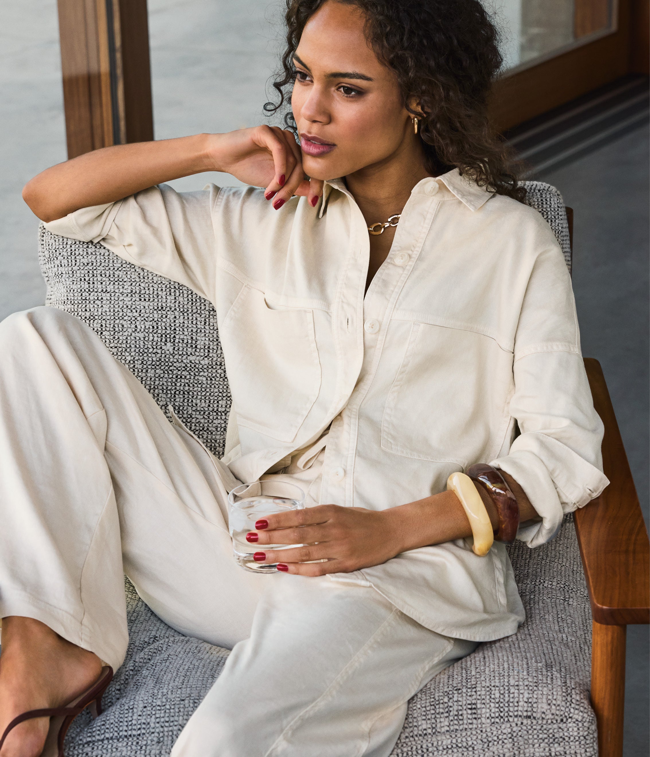 Image of a woman wearing an ivory matching set