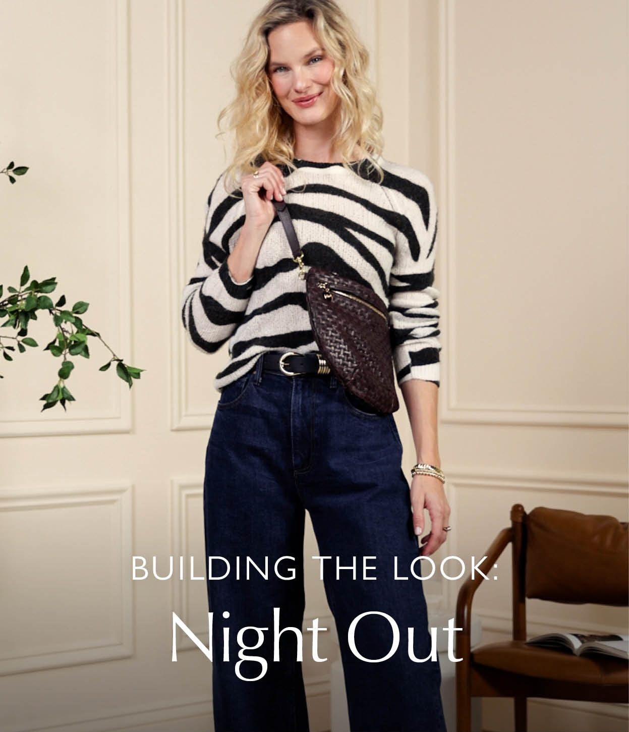 Image of woman wearing stripe long sleeve tee with blue jeans