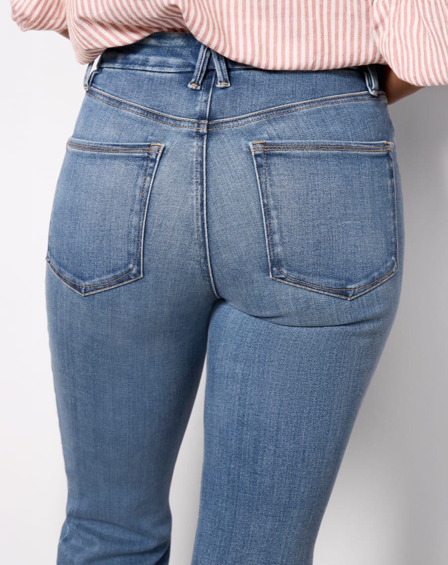 Image of the back pockets of a woman wearing blue jeans