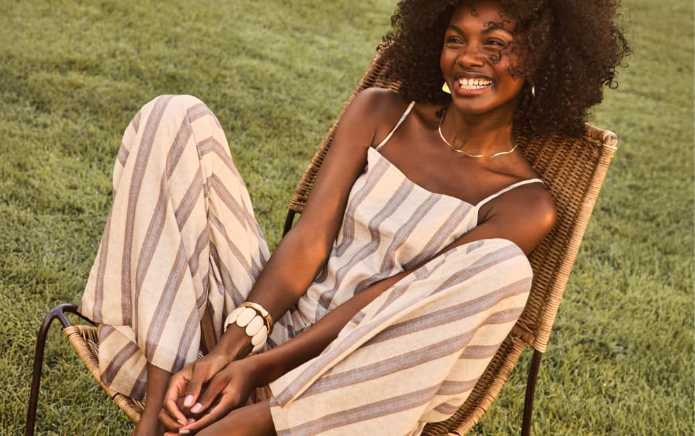 Image of woman wearing stripe tank and matching wide leg pants