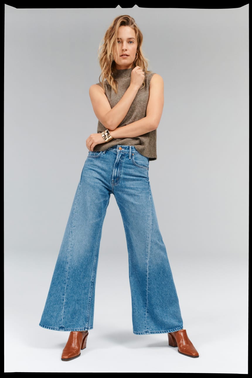 Image of woman wearing wide leg petite jeans