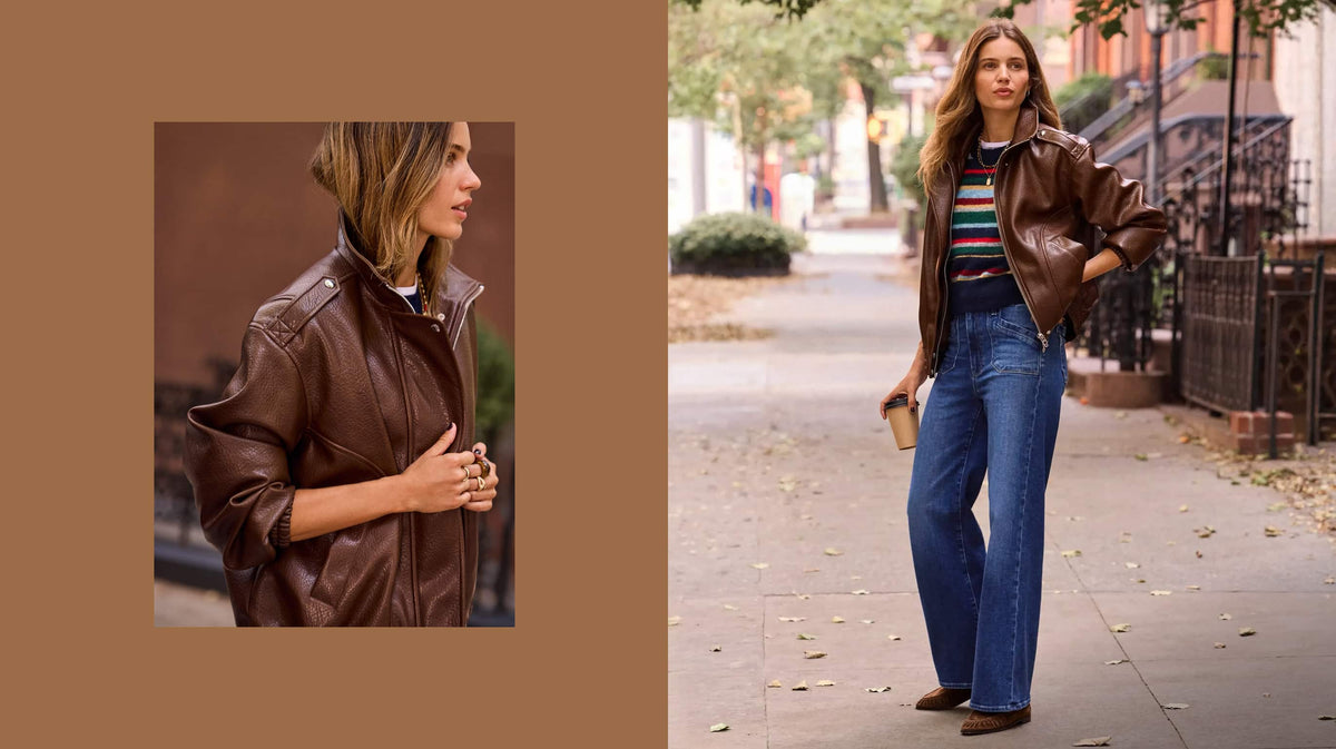 Woman wearing wide leg jeans with a stripe sweater and brown bomber jacket.