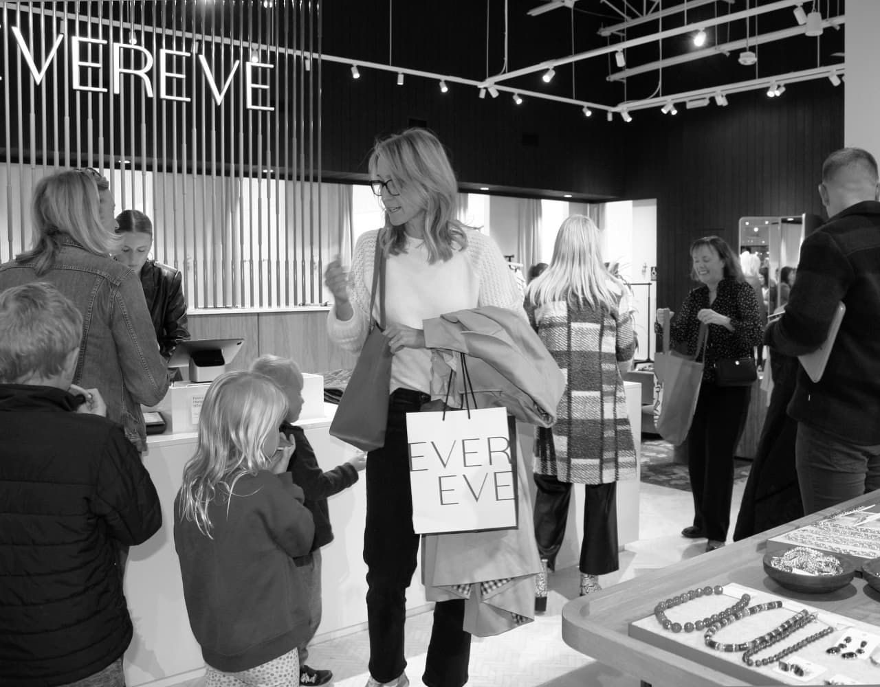 Image of several people shopping at an EVEREVE store. 