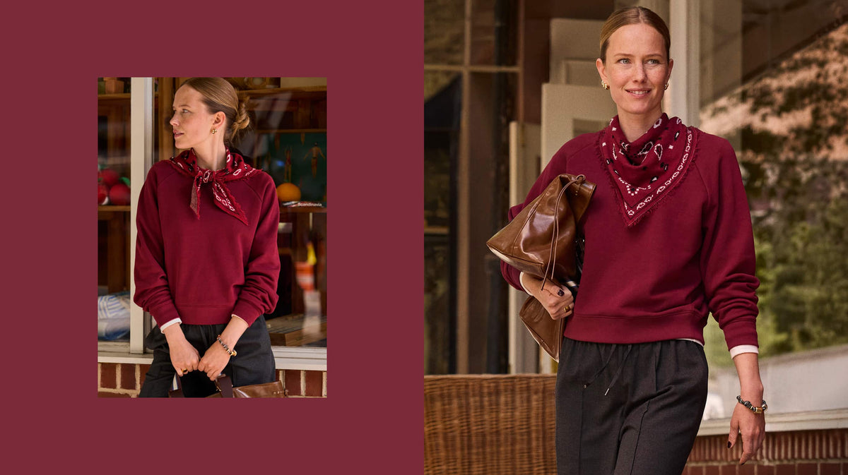 Woman wearing a burgundy sweatshirt with bandana scarf and pull on pants. 