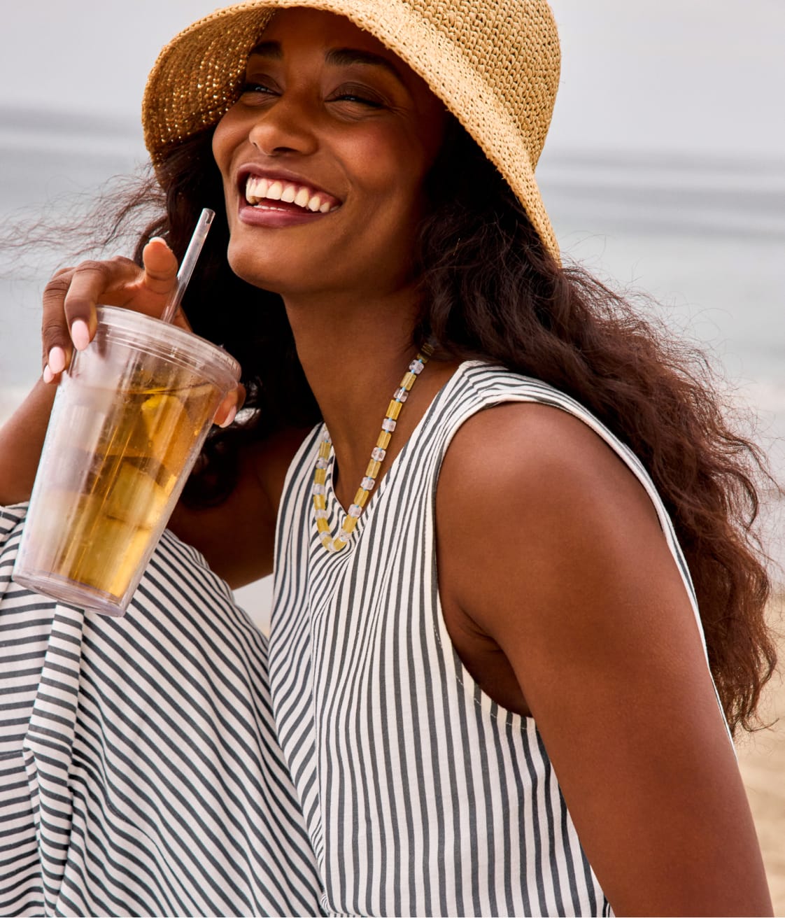 Image of woman wearing a striped tank and matching striped pants