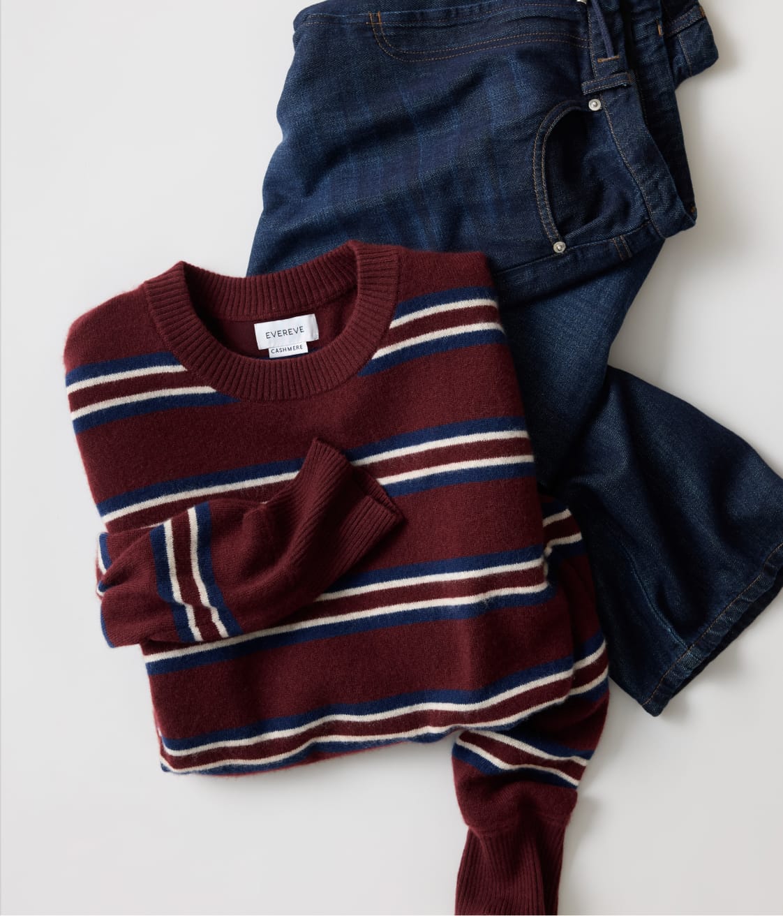 Burgundy stripe sweater with dark wash jeans