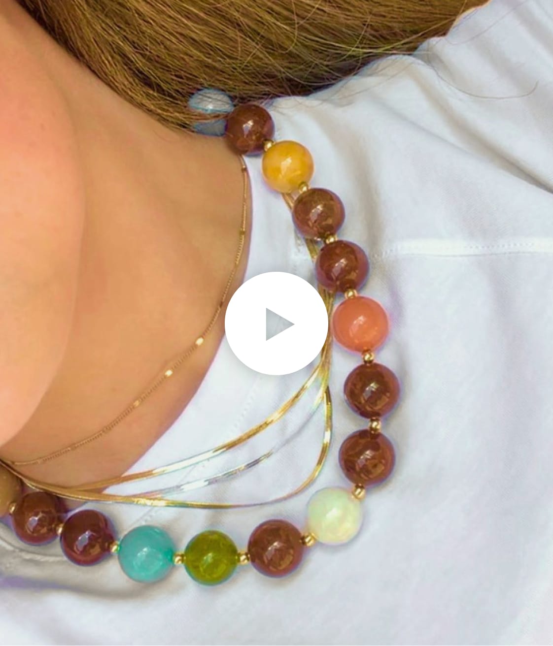 Video of woman displaying statement jewelry