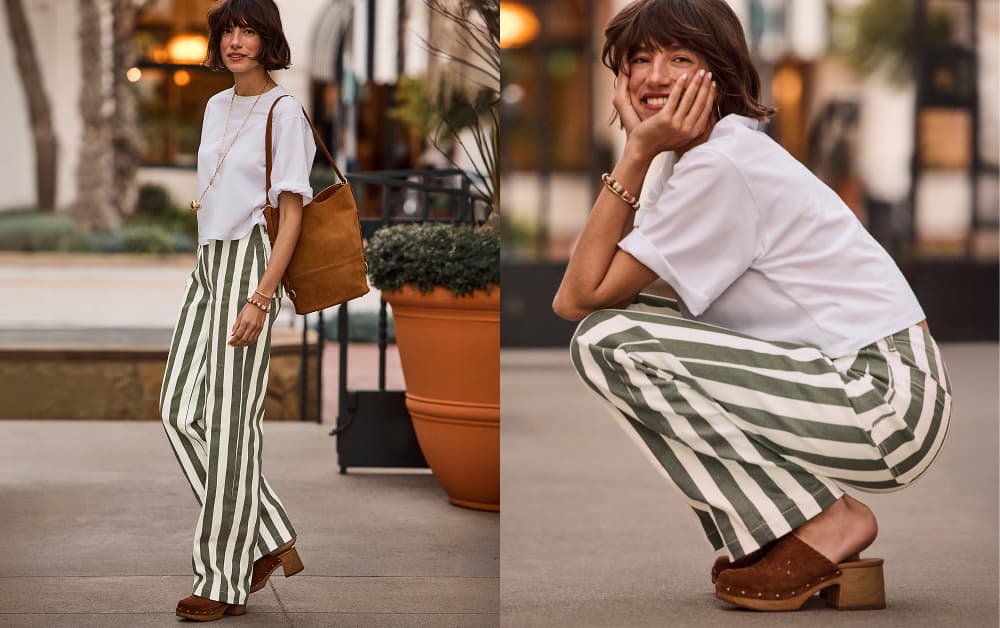 Image of woman wearing a white tee with white and green stripe jeans with brown clogs