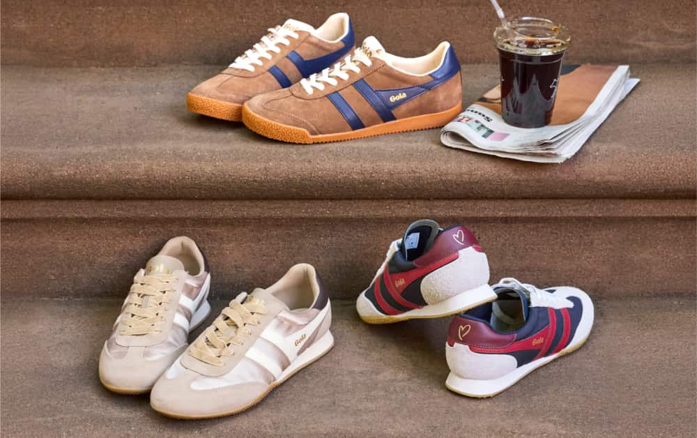 Image of several pairs of Gola sneakers stacked on a set of stairs