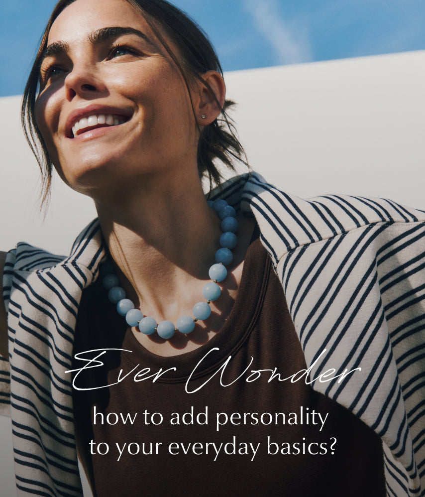 Image of woman wearing a striped sweatshirt with a turquoise beaded necklace
