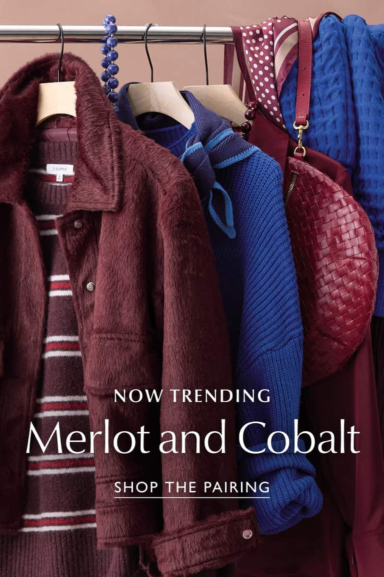 Cobalt blue and Merlot colored womens fashion items by EVEREVE hanging on a clothing rack.