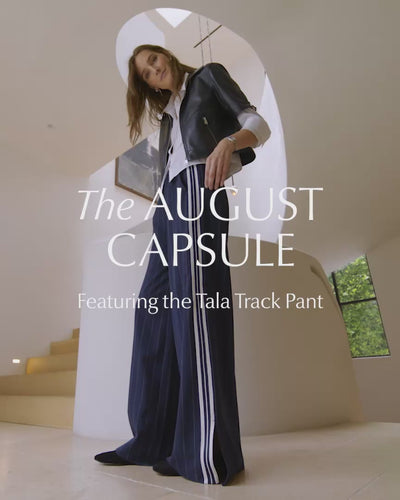 Video of woman wearing navy moto jacket and track pants, The August Capsule